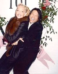 Zang Toi hugs former Charlie’s Angels star Farrah Fawcett after one of his shows in New York.